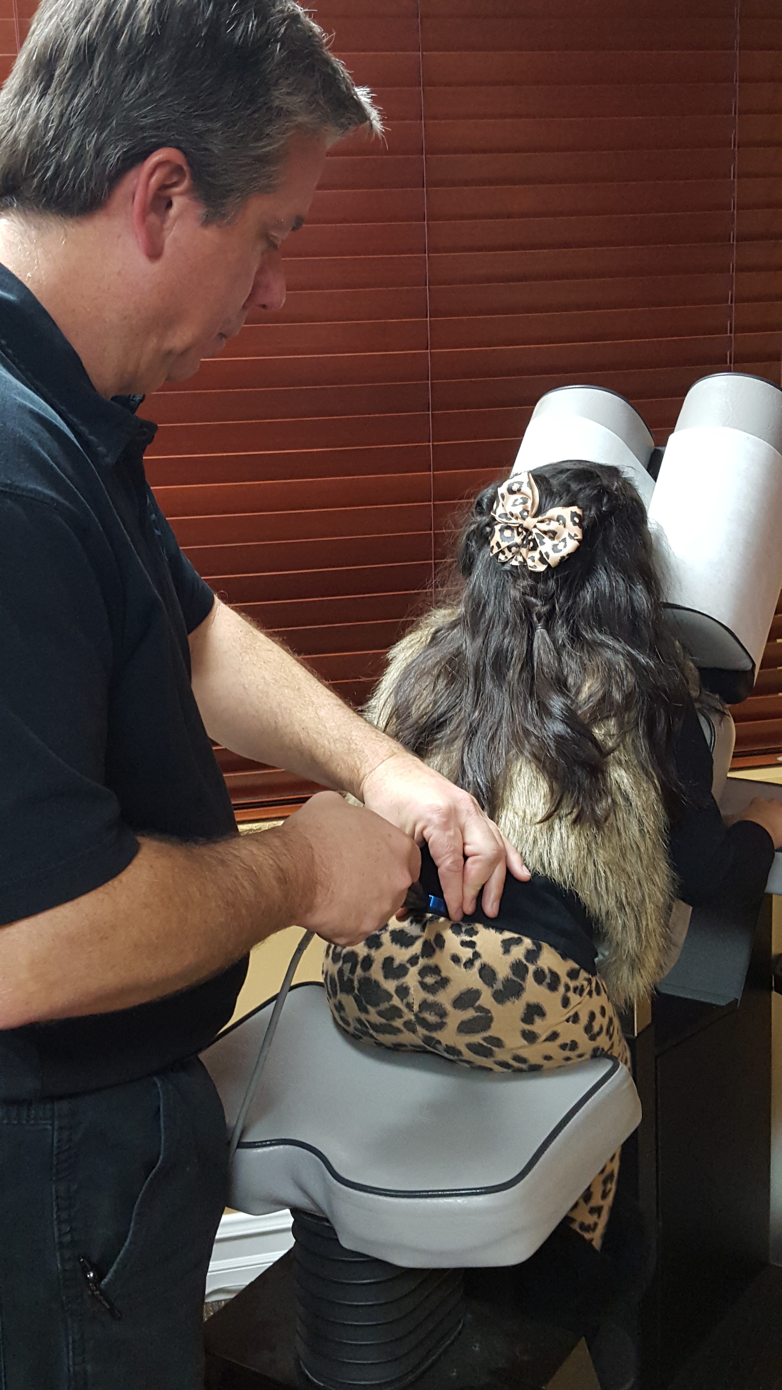 Dr. Gary B. Wright performing a computerized ProAdjuster chiropractic adjustment in Anaheim, CA